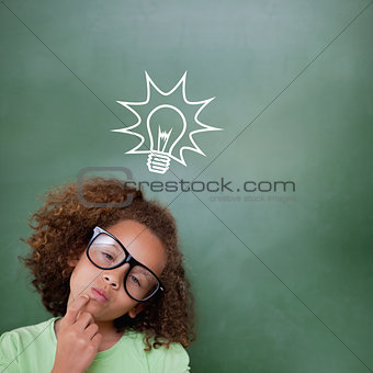 Composite image of cute pupil thinking