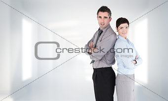 Composite image of office workers standing up back-to-back