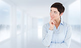 Composite image of thoughtful businesswoman with hand on her chin