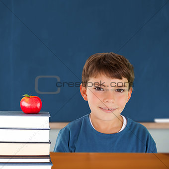 Composite image of cute boy smiling