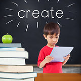 Create against green apple on pile of books in classroom