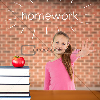 Homework against red apple on pile of books