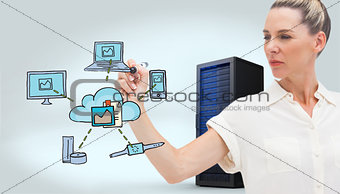 Composite image of serious businesswoman looking at pen in her hand