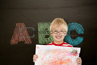 Composite image of cute boy showing his art