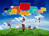 Composite image of happy students with speech bubbles