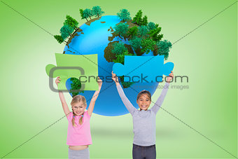 Composite image of elementary pupils holding jigsaw pieces