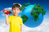 Composite image of cute boy playing with toy airplane