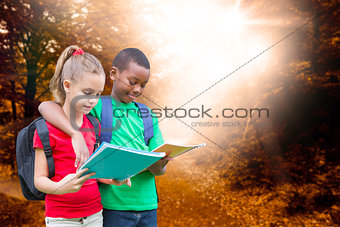 Composite image of cute pupils reading