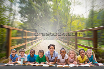 Composite image of cute pupils smiling at camera with teacher