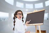 Composite image of cute pupil with chalkboard