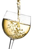 white wine pouring into glass tilted with space for text 