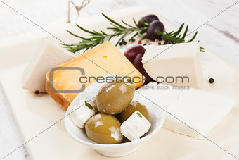 Luxurious cheese and olive background.