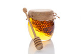 Honey jar with wooden dipper.