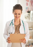 Portrait of doctor woman with clipboard