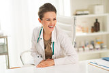 Portrait of smiling doctor woman in office
