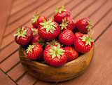Fresh strawberries in wood bowl 
