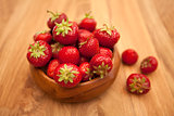 Fresh strawberries in wood bowl 