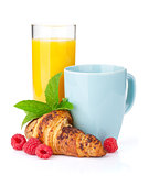 Cup of coffee, orange juice and fresh croissant