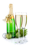 Champagne bottle, glasses and christmas decor