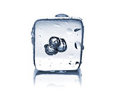 Melting ice cube with water dew