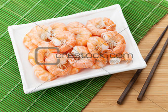 Cooked shrimps and chopsticks