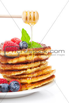 Pancakes with raspberry, blueberry, mint and honey syrup