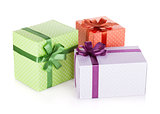 Three colorful gift boxes with ribbon and bow