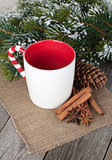 Empty cup for mulled wine, spices and fir tree