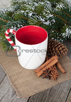 Empty cup for mulled wine, spices and fir tree