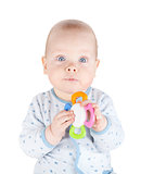 Cute baby boy is holding toy