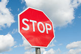 Stop sign over blue sky background