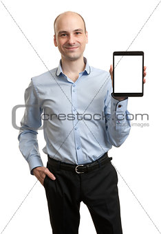 Smiling executive holding a tablet