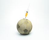 syringe in to the old football isolated
