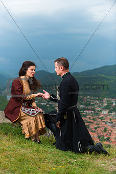 Man and woman in Georgian national dress. 