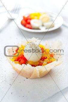 Hard boiled quail eggs with capsicum in cheese basket