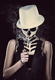 Woman with skeleton face art smoking