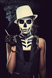 Woman with skeleton face art smoking