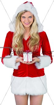 Pretty girl in santa outfit holding gift