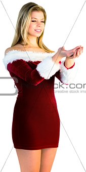 Pretty girl holding hands out in santa outfit