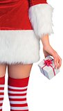 Pretty girl in santa outfit holding gift