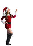 Pretty santa girl pointing and smiling