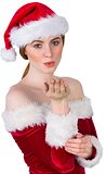 Pretty girl in santa costume holding hand out