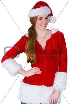 Pretty girl in santa costume smiling at camera