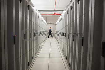 Technician walking in server hallway