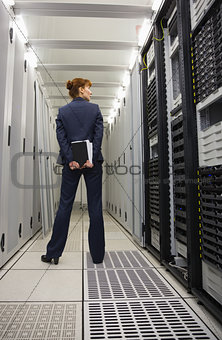 Technician standing in server hallway