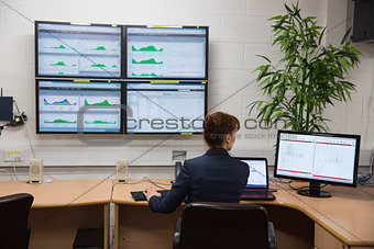 Technician sitting in office running diagnostics