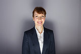 Businesswoman in suit smiling at camera