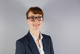 Businesswoman in glasses smiling at camera