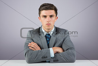 Serious businessman sitting at desk