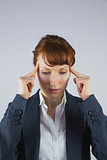 Stressed businesswoman getting a headache